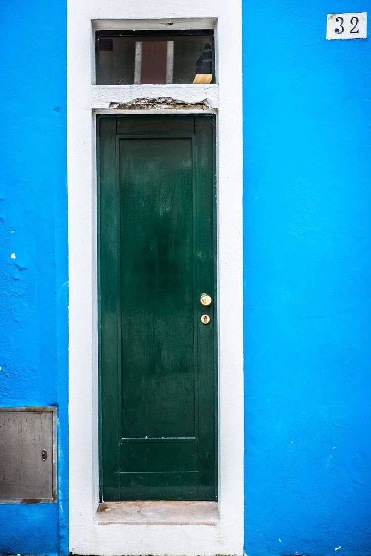 Green door numbered 32
