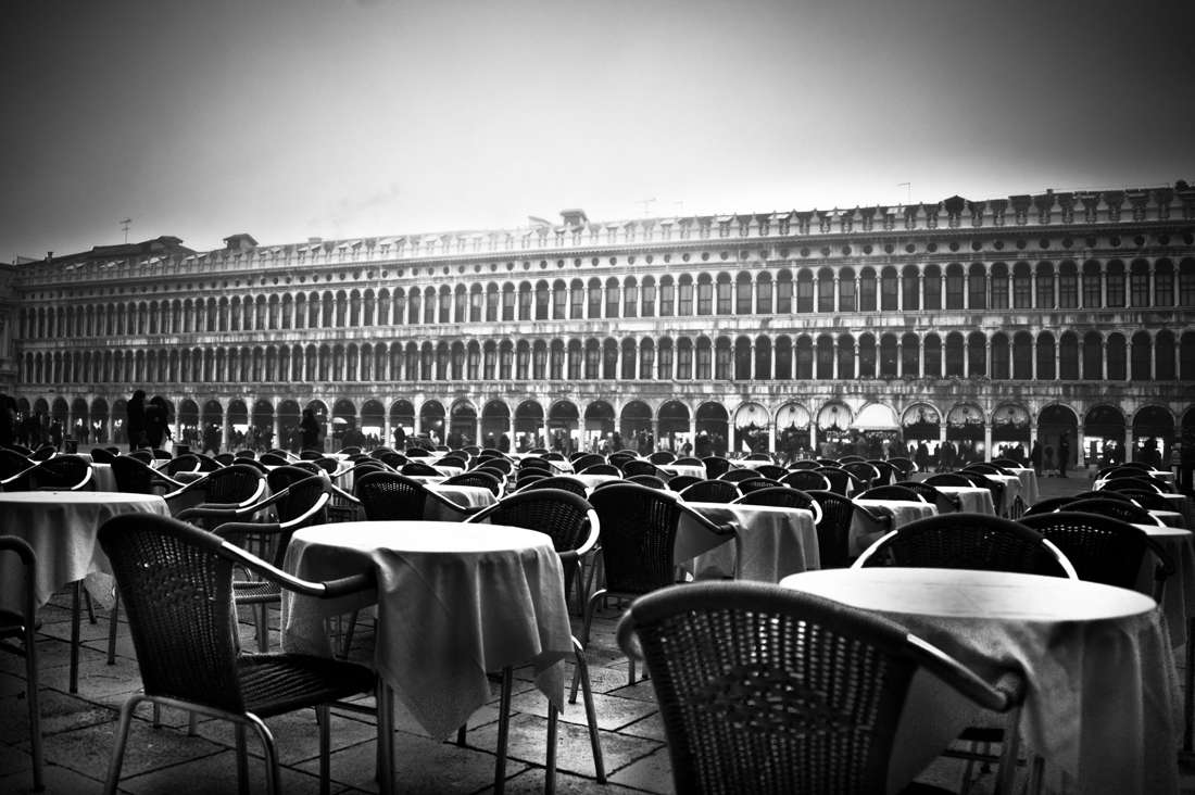 Empty tables in a black and white square