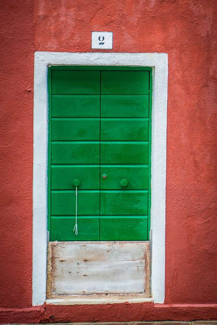 Green door numbered 2