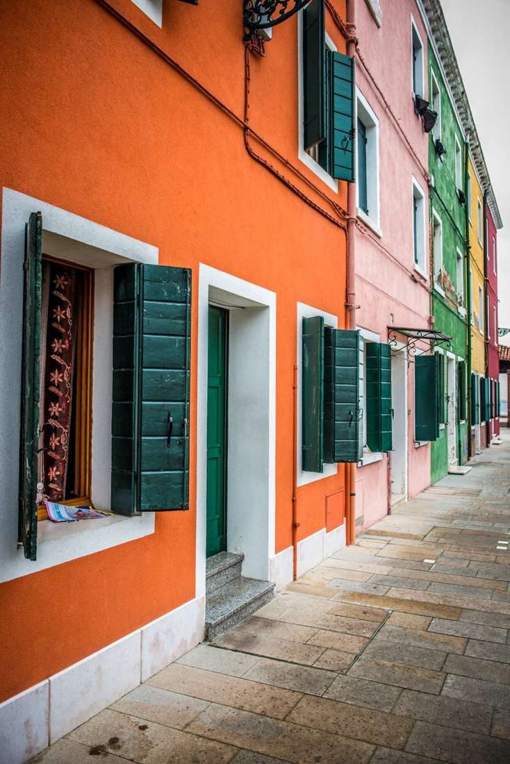 Orange house and a receding alley