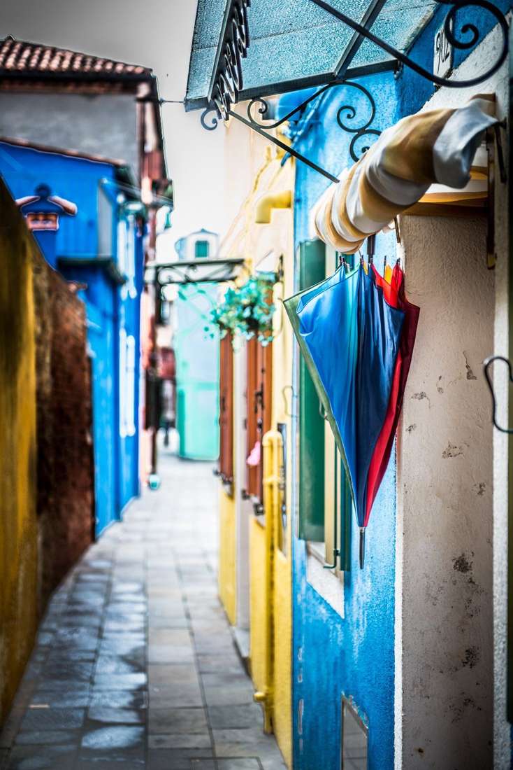 Umbrellas in an alley